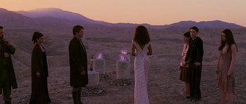 Movie still from “Serenity” (2005), directed by Joss Whedon – A man and a woman standing in a desert; Wide shot, Over the shoulder angle