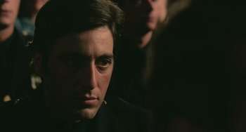 Movie still from “Serpico” (1973), directed by Sidney Lumet – A man's face in the dark; Close Up shot, Over the shoulder angle