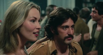 Movie still from “Serpico” (1973), directed by Sidney Lumet – A man and a woman are looking at each other; Close Up shot, Over the shoulder angle