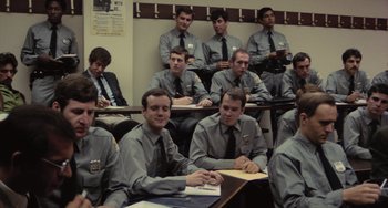 Movie still from “Serpico” (1973), directed by Sidney Lumet – A group of young men sitting in a classroom; Medium shot, High angle