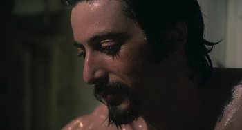 Movie still from “Serpico” (1973), directed by Sidney Lumet – A person with a beard; Close Up shot, Over the shoulder angle