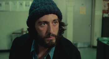 Movie still from “Serpico” (1973), directed by Sidney Lumet – A person wearing a hat; Close Up shot, Low angle