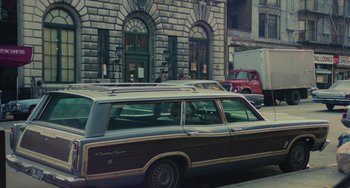 Movie still from “Serpico” (1973), directed by Sidney Lumet – An old car parked on the side of the street; Wide shot, High angle