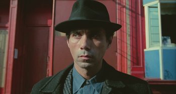 Movie still from “Serpico” (1973), directed by Sidney Lumet – A person wearing a hat; Close Up shot, Low angle