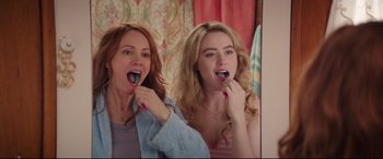 Movie still from “Blockers” (2018), directed by Kay Cannon – Two women brushing their teeth in front of a mirror; Close Up shot, Over the shoulder angle