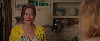 Movie still from “Blockers” (2018), directed by Kay Cannon – A woman standing in a kitchen next to a counter; Medium shot, Over the shoulder angle