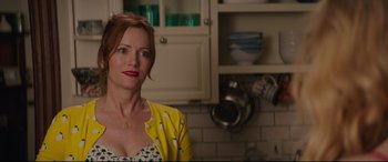 Movie still from “Blockers” (2018), directed by Kay Cannon – A woman standing in a kitchen next to a counter; Close Up shot, Over the shoulder angle