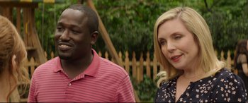 Movie still from “Blockers” (2018), directed by Kay Cannon – A man and a woman standing next to each other; Close Up shot, Over the shoulder angle