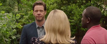 Movie still from “Blockers” (2018), directed by Kay Cannon – A man and a woman are talking to each other; Close Up shot, Over the shoulder angle