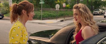 Movie still from “Blockers” (2018), directed by Kay Cannon – Two women sitting in the back seat of a black car; Close Up shot, Over the shoulder angle