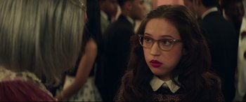 Movie still from “Blockers” (2018), directed by Kay Cannon – A woman with glasses and a black dress; Close Up shot, Over the shoulder angle