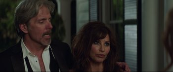 Movie still from “Blockers” (2018), directed by Kay Cannon – A person with long brown hair; Close Up shot, Over the shoulder angle