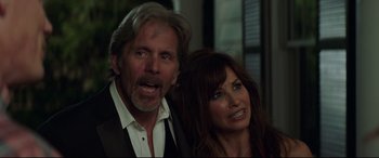 Movie still from “Blockers” (2018), directed by Kay Cannon – A man and a woman standing next to each other; Close Up shot, Over the shoulder angle