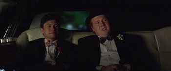 Movie still from “Blockers” (2018), directed by Kay Cannon – Two men sitting in the back of a car; Medium shot, Low angle