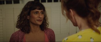 Movie still from “Blockers” (2018), directed by Kay Cannon – A woman looking at her reflection in a mirror; Close Up shot, Over the shoulder angle