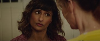 Movie still from “Blockers” (2018), directed by Kay Cannon – A person looking into a mirror; Close Up shot, Over the shoulder angle