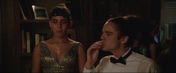 Movie still from “Blockers” (2018), directed by Kay Cannon – A man and a woman sitting next to each other; Close Up shot, Over the shoulder angle