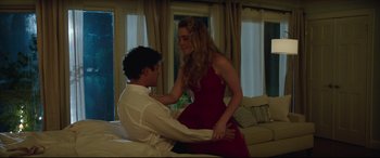 Movie still from “Blockers” (2018), directed by Kay Cannon – A man and a woman in a red dress; Medium shot, Low angle