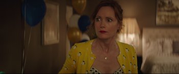 Movie still from “Blockers” (2018), directed by Kay Cannon – A person wearing a yellow jacket; Close Up shot, Over the shoulder angle