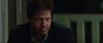 Movie still from “Blockers” (2018), directed by Kay Cannon – A person wearing a suit and tie; Close Up shot, Over the shoulder angle