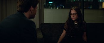 Movie still from “Blockers” (2018), directed by Kay Cannon – A woman sitting on a couch talking to a man; Medium shot, Over the shoulder angle