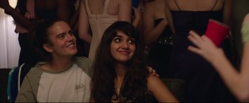 Movie still from “Blockers” (2018), directed by Kay Cannon – A woman with long brown hair is looking up; Medium shot, Over the shoulder angle