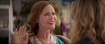 Movie still from “Blockers” (2018), directed by Kay Cannon – A person smiling; Close Up shot, Over the shoulder angle