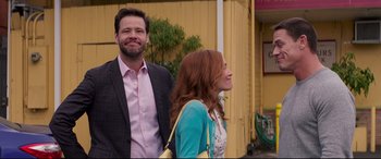 Movie still from “Blockers” (2018), directed by Kay Cannon – A man and a woman standing next to each other; Medium shot, Over the shoulder angle