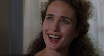 Movie still from “Sex, Lies, and Videotape” (1989), directed by Steven Soderbergh – A person with a smile on their face; Close Up shot, Over the shoulder angle