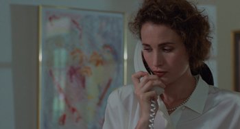 Movie still from “Sex, Lies, and Videotape” (1989), directed by Steven Soderbergh – A woman talking on a phone while wearing pearls; Close Up shot, Over the shoulder angle