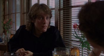 Movie still from “Sex, Lies, and Videotape” (1989), directed by Steven Soderbergh – A man sitting in front of a window; Close Up shot, Over the shoulder angle