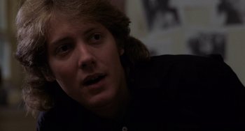Movie still from “Sex, Lies, and Videotape” (1989), directed by Steven Soderbergh – A person wearing a black shirt; Close Up shot, Over the shoulder angle