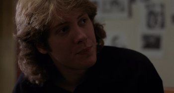 Movie still from “Sex, Lies, and Videotape” (1989), directed by Steven Soderbergh – A person wearing a black shirt; Close Up shot, Over the shoulder angle