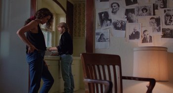 Movie still from “Sex, Lies, and Videotape” (1989), directed by Steven Soderbergh – Two people standing in a room next to a window; Wide shot, Over the shoulder angle