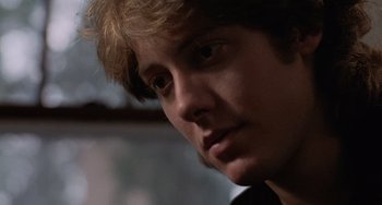 Movie still from “Sex, Lies, and Videotape” (1989), directed by Steven Soderbergh – A person wearing a tie; Close Up shot, Over the shoulder angle