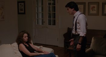 Movie still from “Sex, Lies, and Videotape” (1989), directed by Steven Soderbergh – A man and a woman sitting on the floor in a living room; Medium shot, Over the shoulder angle
