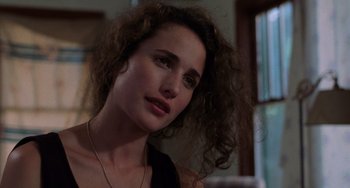 Movie still from “Sex, Lies, and Videotape” (1989), directed by Steven Soderbergh – A person with curly hair; Close Up shot, Over the shoulder angle