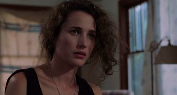 Movie still from “Sex, Lies, and Videotape” (1989), directed by Steven Soderbergh – A person wearing a necklace; Close Up shot, Over the shoulder angle