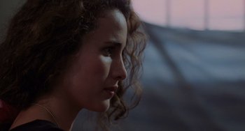 Movie still from “Sex, Lies, and Videotape” (1989), directed by Steven Soderbergh – A person with curly hair; Close Up shot, Over the shoulder angle
