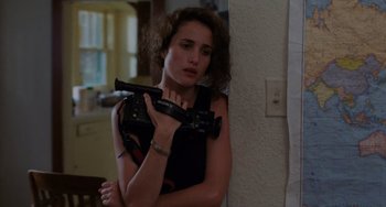 Movie still from “Sex, Lies, and Videotape” (1989), directed by Steven Soderbergh – A woman holding a video camera in her hands; Close Up shot, High angle