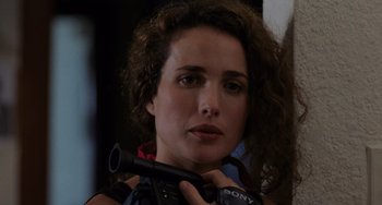 Movie still from “Sex, Lies, and Videotape” (1989), directed by Steven Soderbergh – A person holding a video camera; Close Up shot, Over the shoulder angle