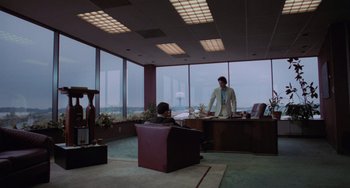 Movie still from “Sex, Lies, and Videotape” (1989), directed by Steven Soderbergh – Two people in a room with a large window; Extreme Wide shot, Low angle
