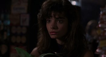 Movie still from “Sex, Lies, and Videotape” (1989), directed by Steven Soderbergh – A person with long brown hair; Close Up shot, High angle