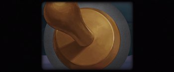 Movie still from “Shadow in the Cloud” (2020), directed by Roseanne Liang – A painting of a person using a plunger to make something; Extreme Close Up shot, Overhead angle