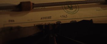 Movie still from “Shadow in the Cloud” (2020), directed by Roseanne Liang – An image of an old typewriter with the date august 1 9 4 3 written on it; Extreme Close Up shot, High angle