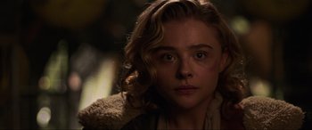 Movie still from “Shadow in the Cloud” (2020), directed by Roseanne Liang – A person wearing a jacket; Close Up shot, Over the shoulder angle