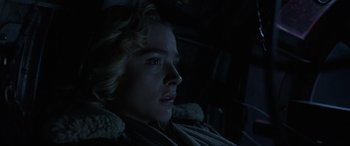 Movie still from “Shadow in the Cloud” (2020), directed by Roseanne Liang – A young man sitting in a car at night; Close Up shot, Low angle