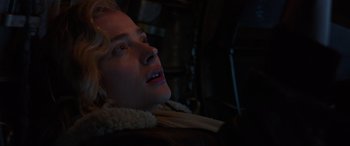 Movie still from “Shadow in the Cloud” (2020), directed by Roseanne Liang – A woman is looking up in the dark; Close Up shot, Low angle