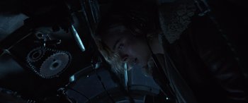Movie still from “Shadow in the Cloud” (2020), directed by Roseanne Liang – A person in a dark room; Close Up shot, Low angle