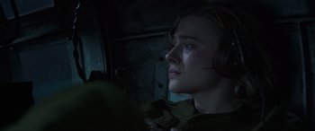 Movie still from “Shadow in the Cloud” (2020), directed by Roseanne Liang – A woman in a dark room looking up at the sky; Close Up shot, High angle